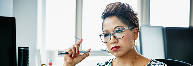 Businesswoman working at office workstation